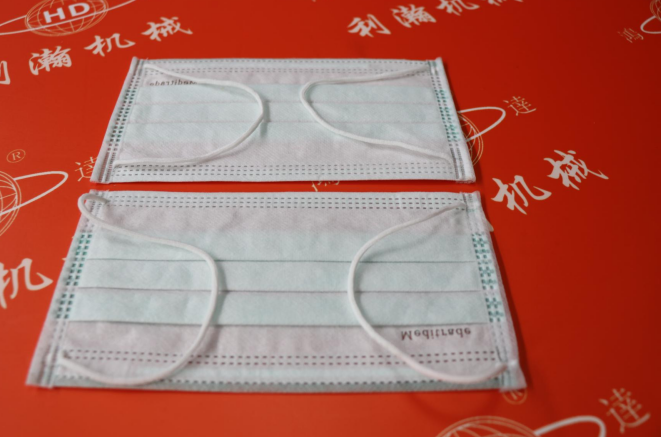 高速全電內(nèi)耳包邊口罩機(jī)HD-11107 高速全電內(nèi)耳包邊口罩機(jī)HD-11107